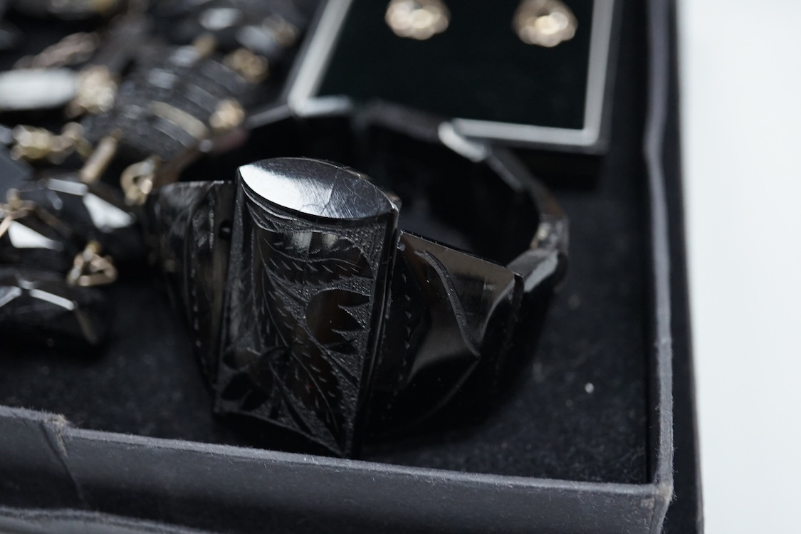 A small group of assorted Whitby jet jewellery including a matching bracelet and necklace, etc.